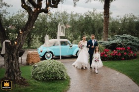 The excited newlyweds celebrate their marriage as they make a grand, cheerful entrance to the reception at the beautiful Cantina Solive in Cortefranca.